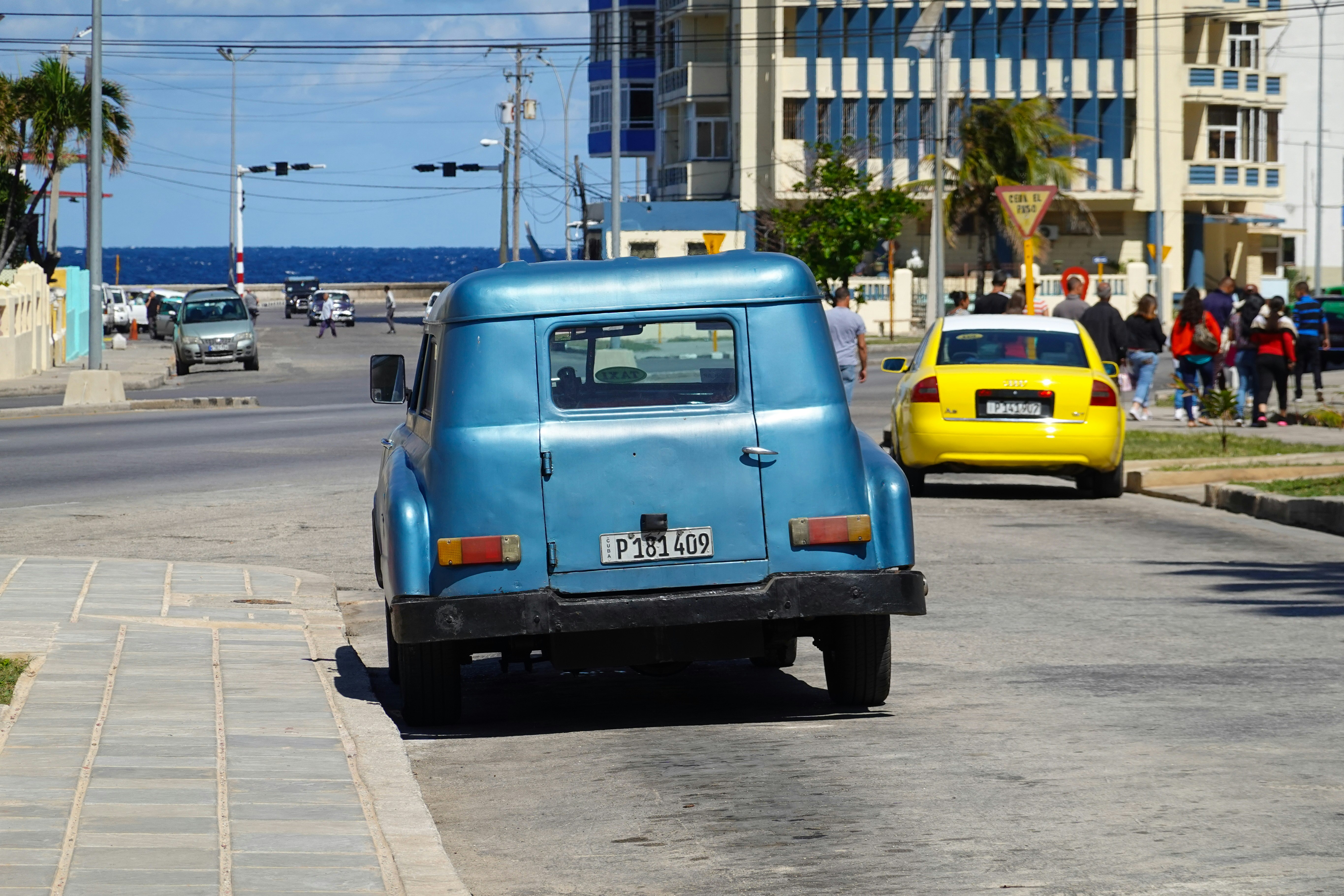 blue van on road during daytime